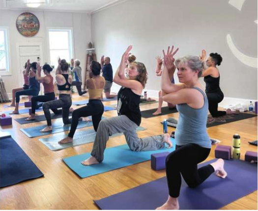 a group of people doing yoga
